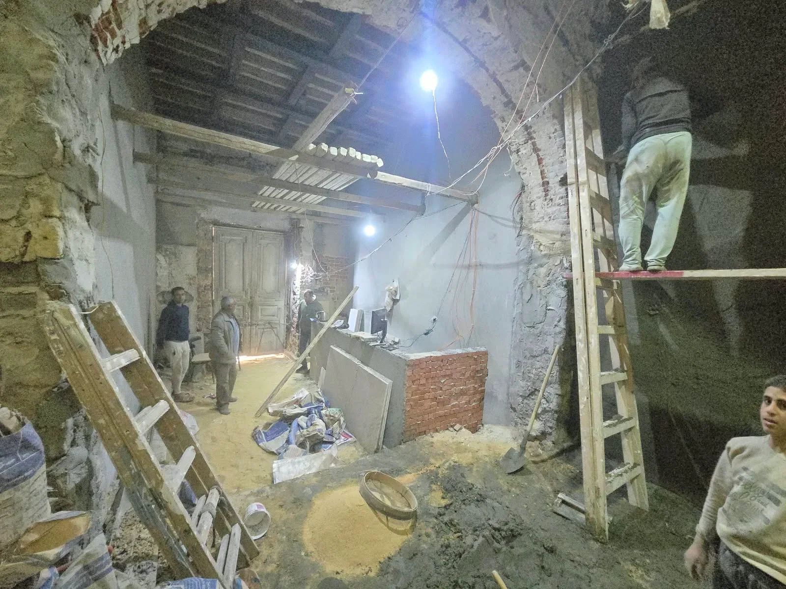 Team working in the lobby during wall and ceiling preparation