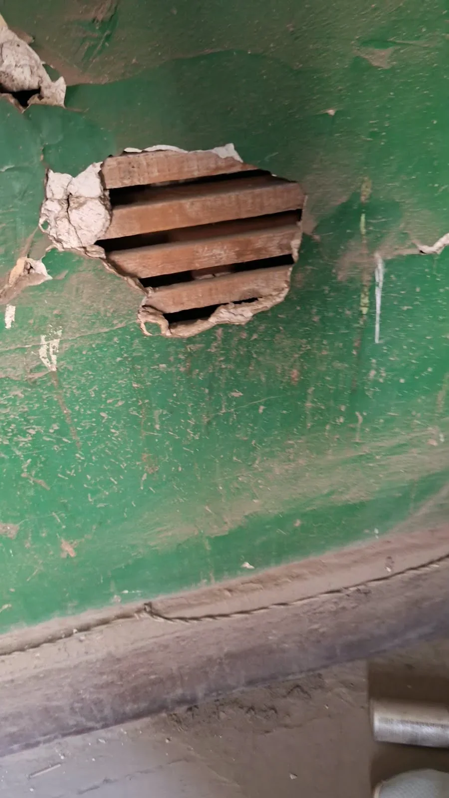 Exposed area in the old wall finish showing the brickwork behind it